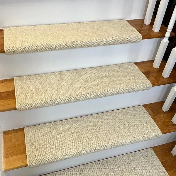 Cream checkered stair runner on wood stairs