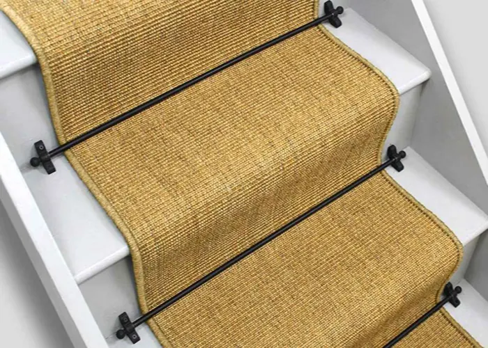 Neutral-toned sisal runner on wooden stairs.