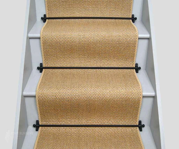 sisal stair runner with a subtle honeycomb weave and a matching beige border