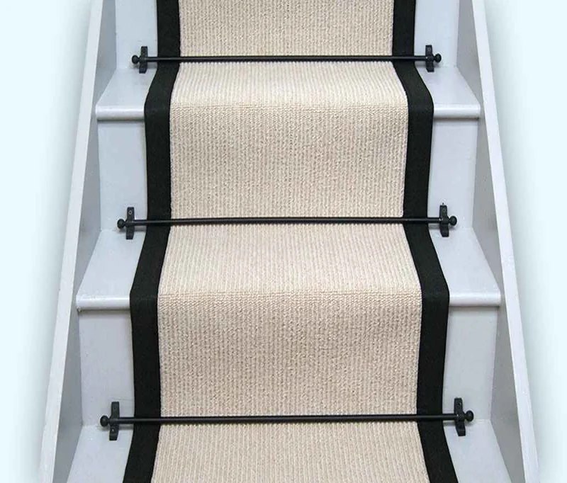textured wool carpet runner with thick black borders.