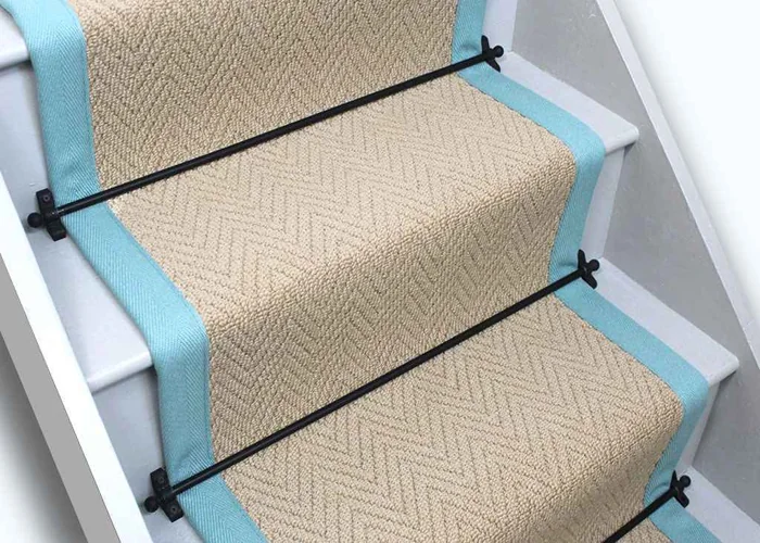 wool stair runner with a subtle chevron weave pattern and a bright turquoise fabric border.