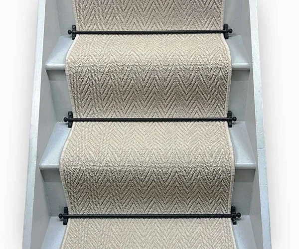 neutral-toned sisal carpet runner with a classic herringbone pattern.